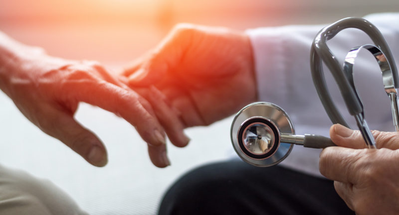 general practitioner giving an annual checkup